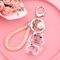 Pink crystal fortune cat keychain with sparkling woven wrist strap and silver bell - Light Blue Transparent Faceted Fortune Cat