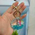 Shell-shaped liquid keychain with pink fish, blue glitter, and golden metal clasp - Shell Shape - Single Buckle Style