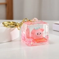 Pink cube keychain with liquid glitter sand and a cute cartoon figure inside - Cube Style (Pink)
