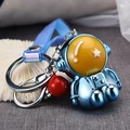 Creative astronaut keychain with metallic blue plating and red bell on a soft wrist strap - Blue