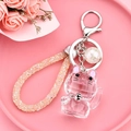 Pink crystal lucky cat keychain with sparkling diamond-studded rope and silver metal clasp - Purple Transparent Faceted Fortune Cat