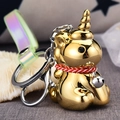 Portachiavi con unicorno dorato con cinturino cangiante e cordoncino rosso intrecciato - Oro