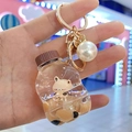 Dettaglio del portachiavi tazza di bubble tea con orsetto e ciondolo a perla - Bottiglia di Soda