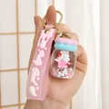 Cute pink rabbit acrylic oil-filled keychain with liquid sand and silicone strap - Leather Strap + Liquid Macaron / Pink with Red Rabbit