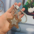 Star-shaped rhinestone keychain pendant with silver and gold crystals and hand strap - Silver Clasp / Ginger Yellow