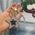 Star keychain with black and white rhinestones and a gold-tone lobster clasp - Light Gold Buckle / Black With White Rhinestones