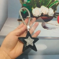 Star-shaped rhinestone keychain in black with sparkling tassel and silver metal clip - With Phone Patch / Black