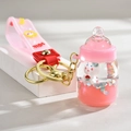 Pink milk bottle keychain with liquid sequins and cute rabbit figure inside - Leather Rope Milk Bottle