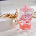 Pink liquid quicksand keychain featuring a cute cartoon cat and white pearl accessory - Pink Fox Milk Tea Cup