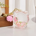 Pink peach quicksand keychain in alarm clock shape with glitter and golden buckle - Peach Style Alarm Clock