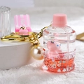 Pink cartoon fox liquid bottle keychain with golden ring and pearl charm pendant - Pink Fox Bucket