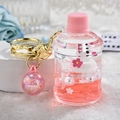 Pink floating rabbit liquid bucket keychain with gold ring and iridescent charm - Bunny Bucket