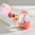 Cute pink liquid quicksand bottle keychain with a tiny rabbit and gold metal clasp - Leather Rope Bottle