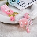 Cute pink star-shaped quicksand keychain with a peach themed strap and small lamb charm - Lamb Peach Pentagram