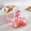 Star-shaped liquid sand keychain with pink fox figure and white pearl detail - Pink Fox Five-Star