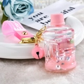 Pink My Melody quicksand keychain featuring a mini water dispenser and glitter fluid - Lamb Peach Bucket