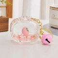 Pink peach liquid quicksand keychain with acrylic charm and gold bell for bags - Peach Style TV