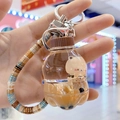 Brown bear milk tea cup keychain with liquid yellow oil and colorful bead wristlet - Soda Bottle Style (Beaded Rope)
