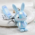 Iridescent blue rabbit keychain with silver metal clip and gradient translucent wrist strap - Blue