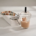 Brown bubble tea cup keychain with liquid and floating bear figure on white display - Round Lid Cup Style (Beaded Rope)