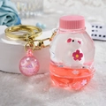 Pink liquid glitter bottle keychain with cute white hamster and golden metal ring charm - Bunny Soda Bottle