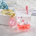 Pink rabbit liquid quicksand keychain in creative milk tea cup shape with gold ring - Bunny Milk Tea Cup
