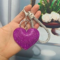 Sparkling dark purple heart-shaped rhinestone keychain with silver clasp held by hand - Keychain [Purple]