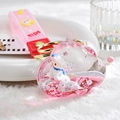 Detail of pink cloud-shaped liquid keychain with glitter, white lamb, and milk strap - Pink