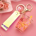Cute fruit tea cup keychain with pink citrus slices and holographic yellow wrist strap - Strap Style Milk Tea Cup [Orange Pink]