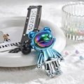 Detail of blue electroplated astronaut bear keychain with rainbow visor and Dream On strap - Blue