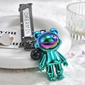 Space astronaut bear keychain with metallic teal finish and Dream On lanyard - Green