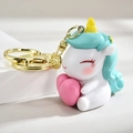 Simpatico portachiavi a forma di unicorno bianco con cuore rosa e criniera verde menta - Blu