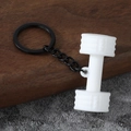 Detailed macro view of white silicone dumbbell keychain with black metal ring and chain - Gym Dumbbell-White