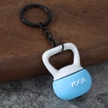 Macro view of blue and white mini kettlebell keychain featuring embossed YOGA lettering - Yoga Kettlebell-Sky Blue