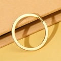 Close-up of a polished gold flat metal key ring accessory on a textured background - Gold Band