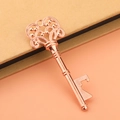 Vintage rose gold skeleton key bottle opener with intricate floral patterns for weddings - Rose Gold