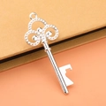 Vintage silver key-shaped bottle opener with clover pattern for wedding favors - Silver