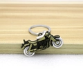 Portachiavi moto retrò in bronzo con ruote mobili su un supporto in legno chiaro - Bronzo