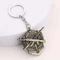 Antik-Bronze Schlüsselanhänger mit gekreuzten Gewehren und Stern für Fans von Militär - Doppelgewehre Weizenähre Medaille Stil / Bronze