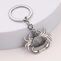 Silver metal crab keychain with vintage texture on a white display stand - Antique Pewter