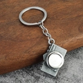 Retro vintage camera shaped alloy keychain with antique silver finish on wood background - Antique Pewter