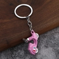Pink vintage scooter keychain with Roma text and Italian flag detail in metal finish - Pink