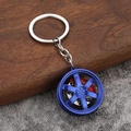 Blue six-spoke car wheel rim keychain with red brake caliper and metal ring chain - Blue