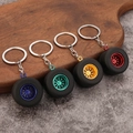 Realistic PVC tire keychains with colorful wheel rims in blue, green, yellow, and red - Dazzling 4-Piece Set (6049789628805)