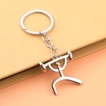Polished silver zinc alloy weightlifting figure keychain with barbell on yellow background - Weightlifting Style - Silver