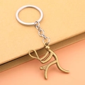 Bronze tennis player keychain accessory on notebook, vintage metallic sports charm gift - Tennis Style - Antique Bronze