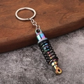 Portachiavi creativo ammortizzatore auto arcobaleno con molla nera e metallo lucido - Colorato