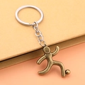 Vintage bronze soccer player keychain with an athletic figure and silver metal ring - Football Style - Antique Bronze