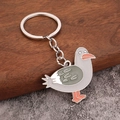 Cute cartoon seagull keychain accessory with enamel finish on a wooden stand - Seagull