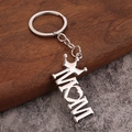 Silver MOM letter keychain with heart and crown charms on a rustic wood surface - Silver Crown MOM
